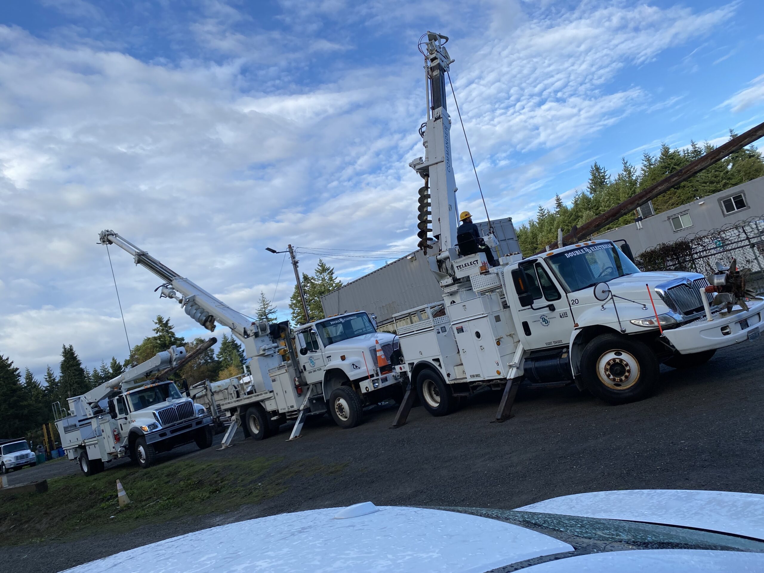 Double D's Pole Trucks Installing Utility Poles at OlyCap in Port Townsend, WA.